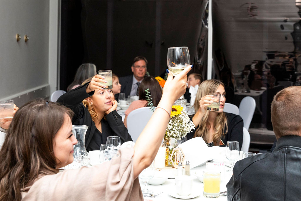 Guests raising their glasses