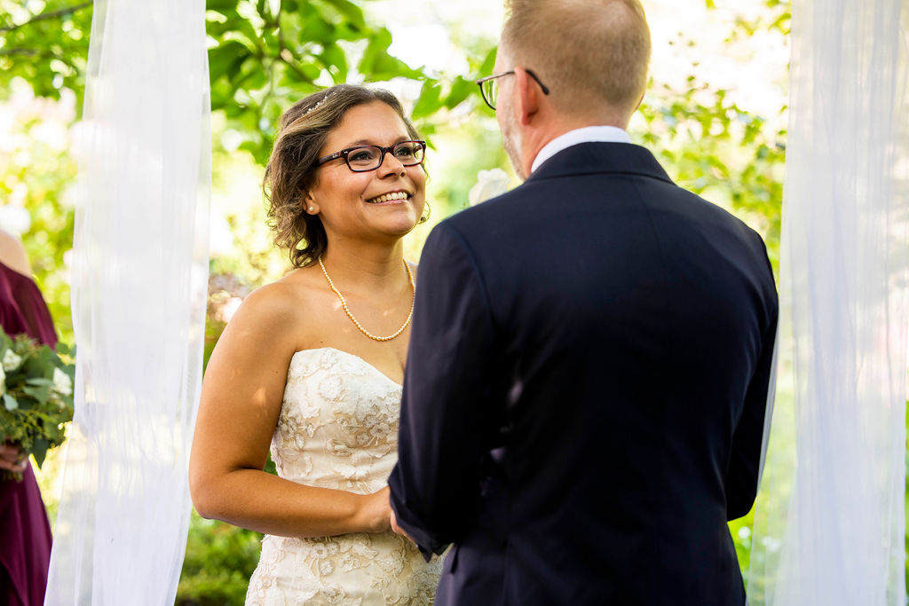 Christine smiling during the vows