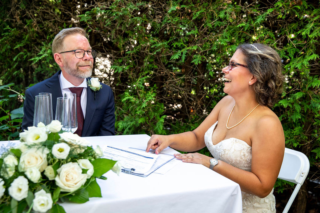 Christine and Mark signing the register