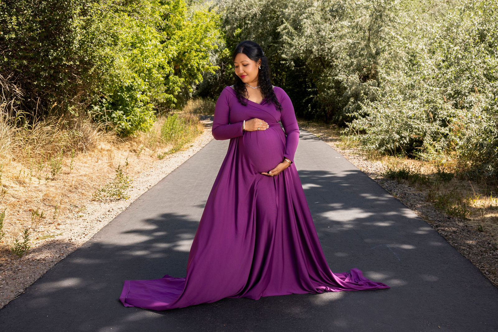 Utah maternity photographer posing expecting mother in flowing gown