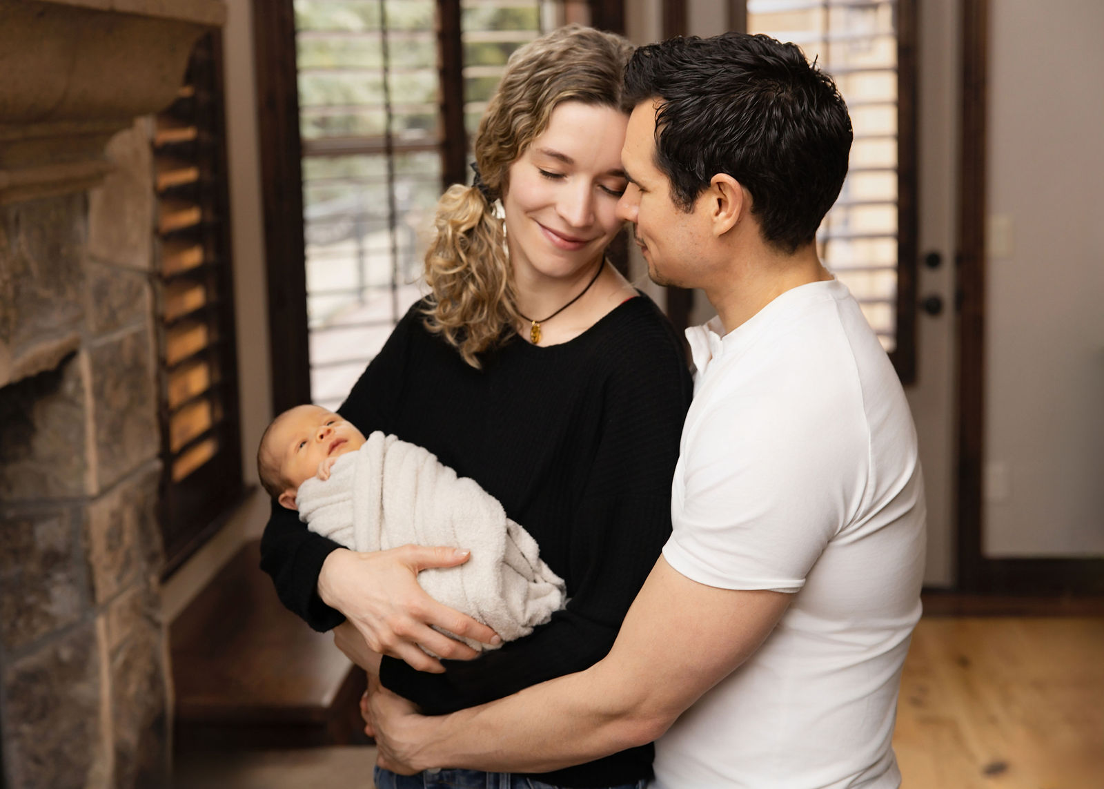 In-home newborn photographer Salt Lake City capturing a softly posed newborn portrait