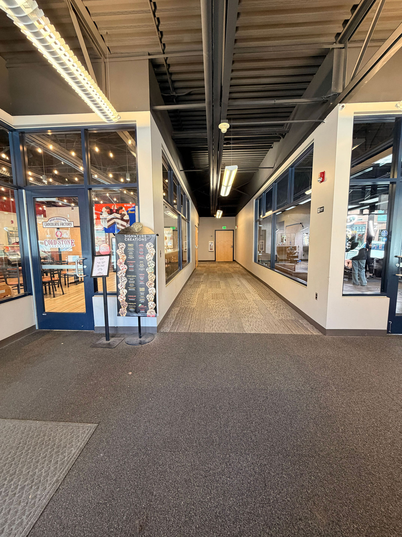 Inside the entrance next to Cold Stone Creamery