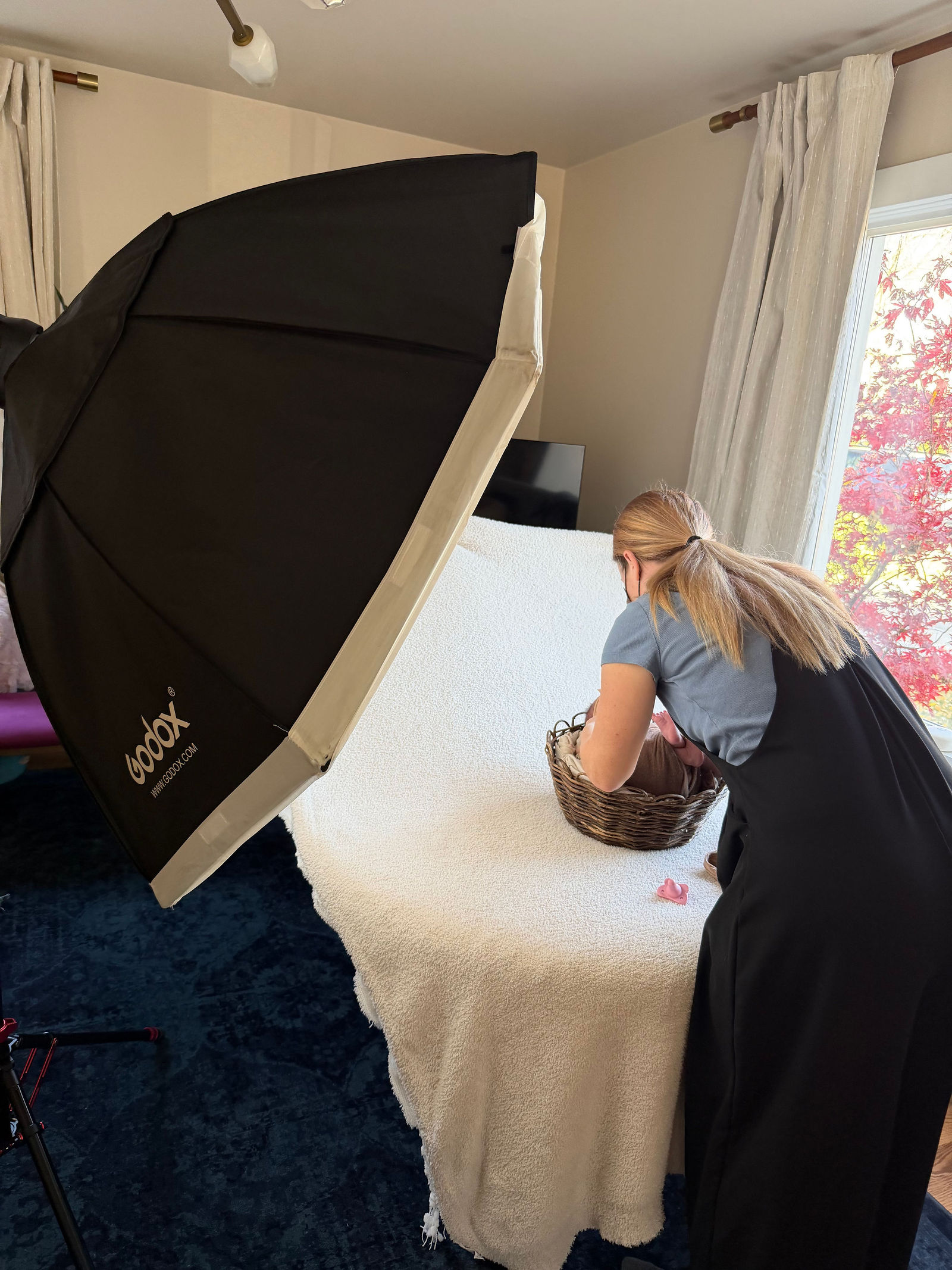 Natural window-light setup for newborn photography inside client’s home in Utah
