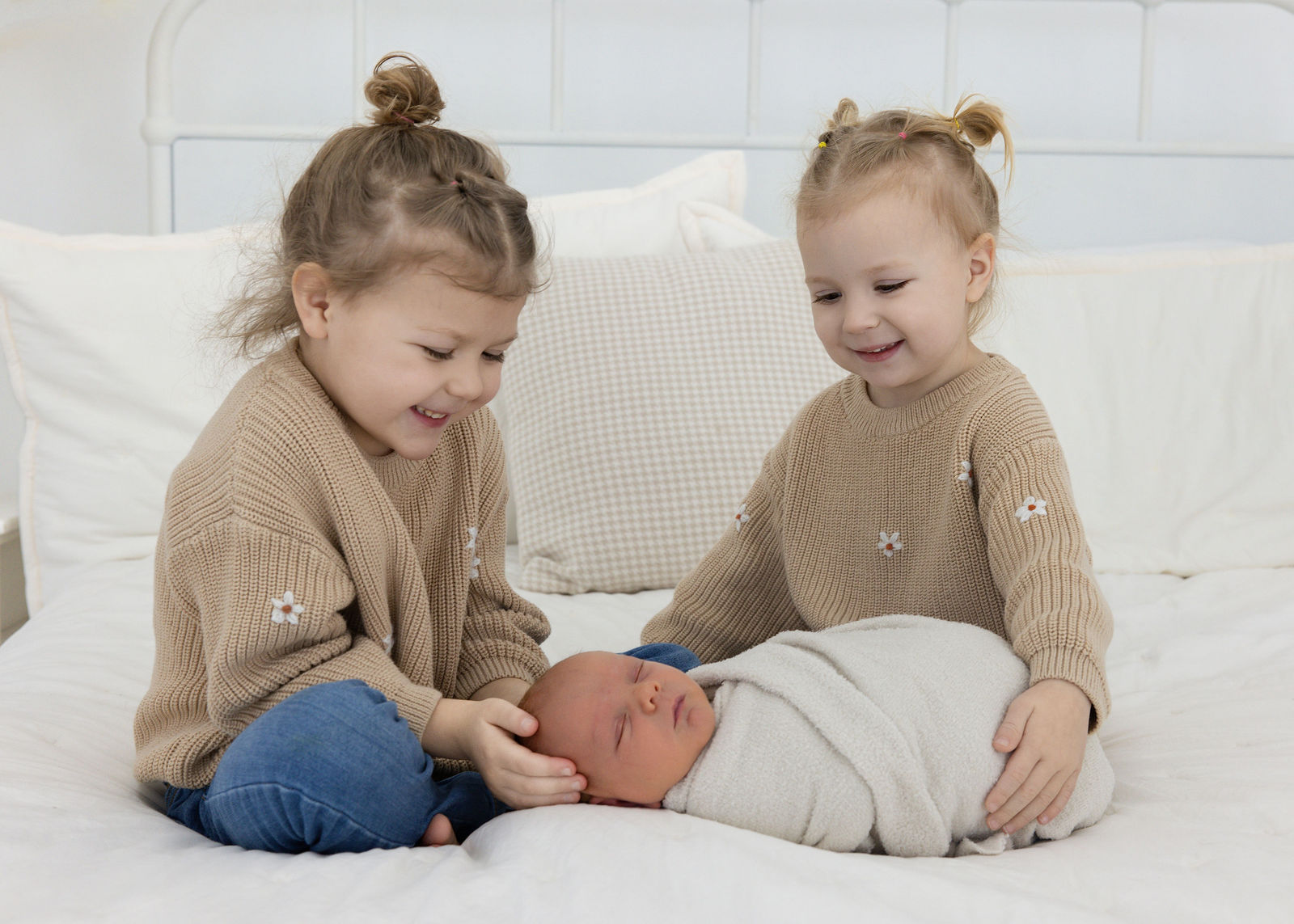 Salt Lake City in-home newborn photographer capturing softly posed newborn on a neutral setup