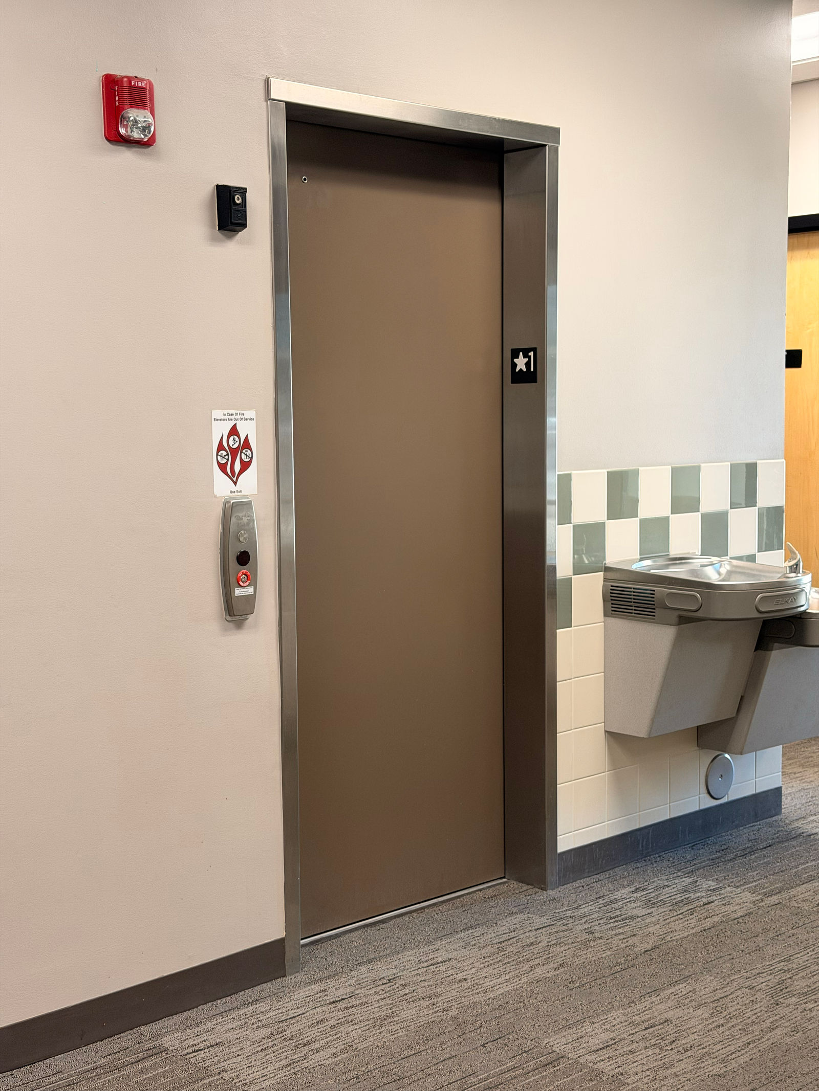 Elevator directly across from the stairs