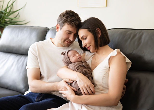 Utah County newborn photographer capturing tiny newborn details like feet and hands during an in-home session
