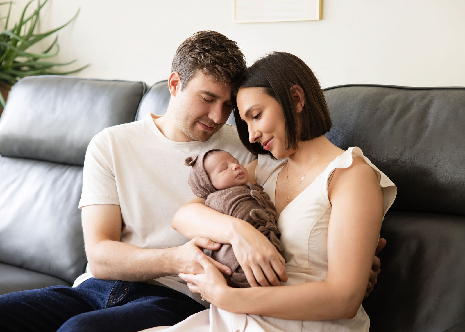 Utah County newborn photographer capturing tiny newborn details like feet and hands during an in-home session