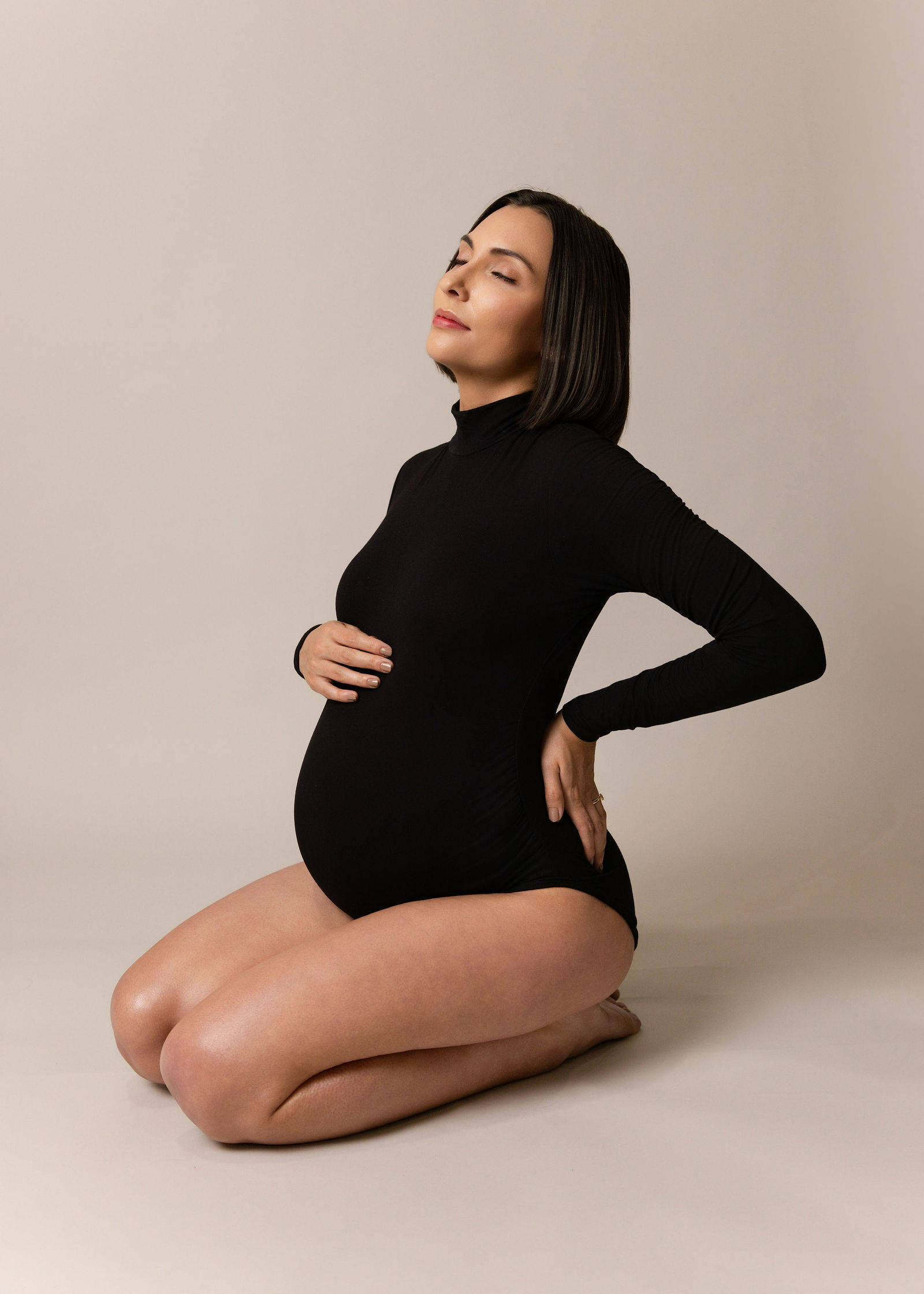 Utah maternity photographer photographing expecting mother in Layton studio