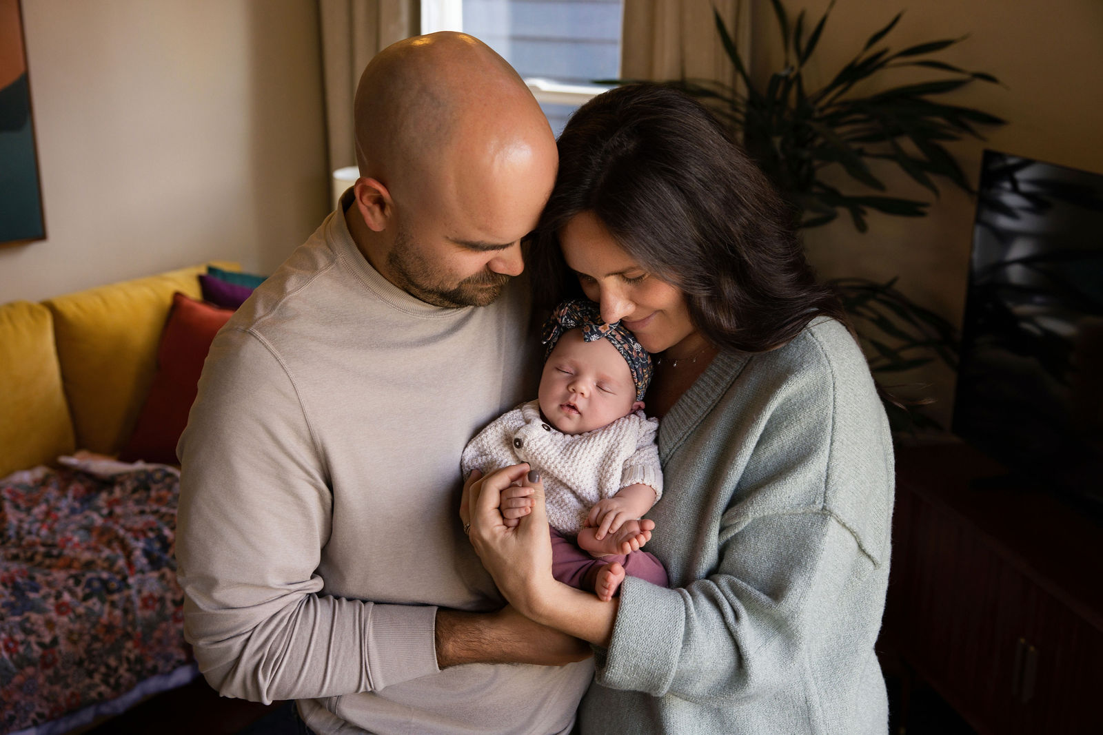 Salt Lake City in-home newborn session detail photo of tiny hands and swaddle