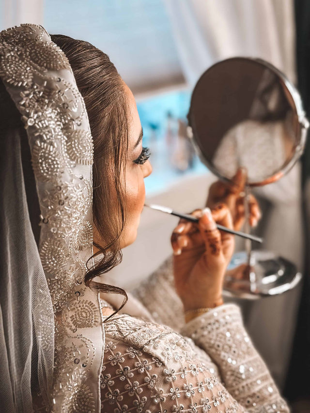 Kinzza Raja bridal makeup and hair styling — radiant bride portrait