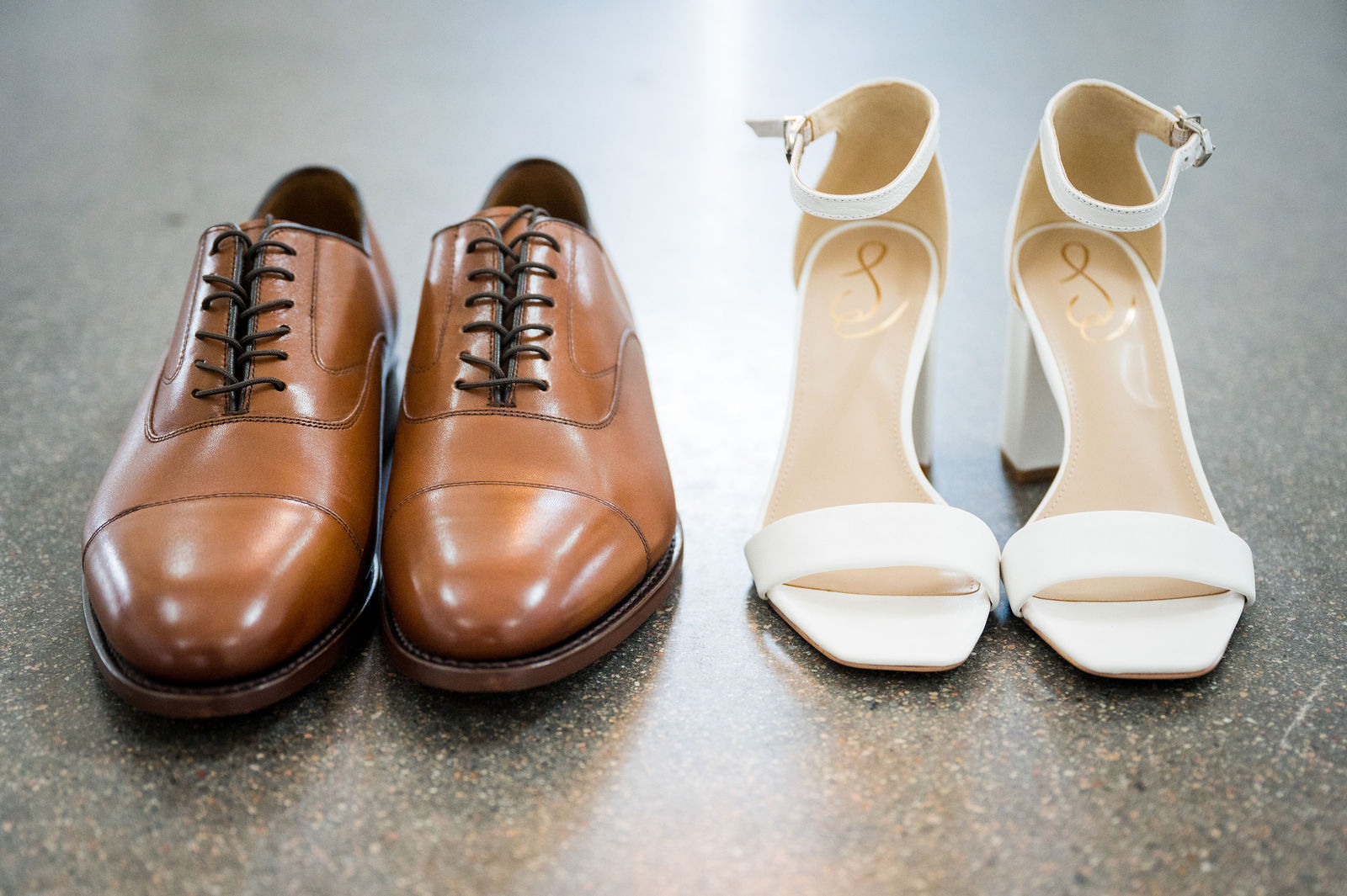 Bride and groom wedding shoes side by side before a Colorado wedding