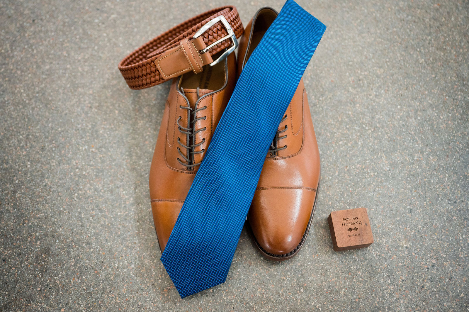 Groom’s wedding day details with tie, shoes and cufflinks in Colorado