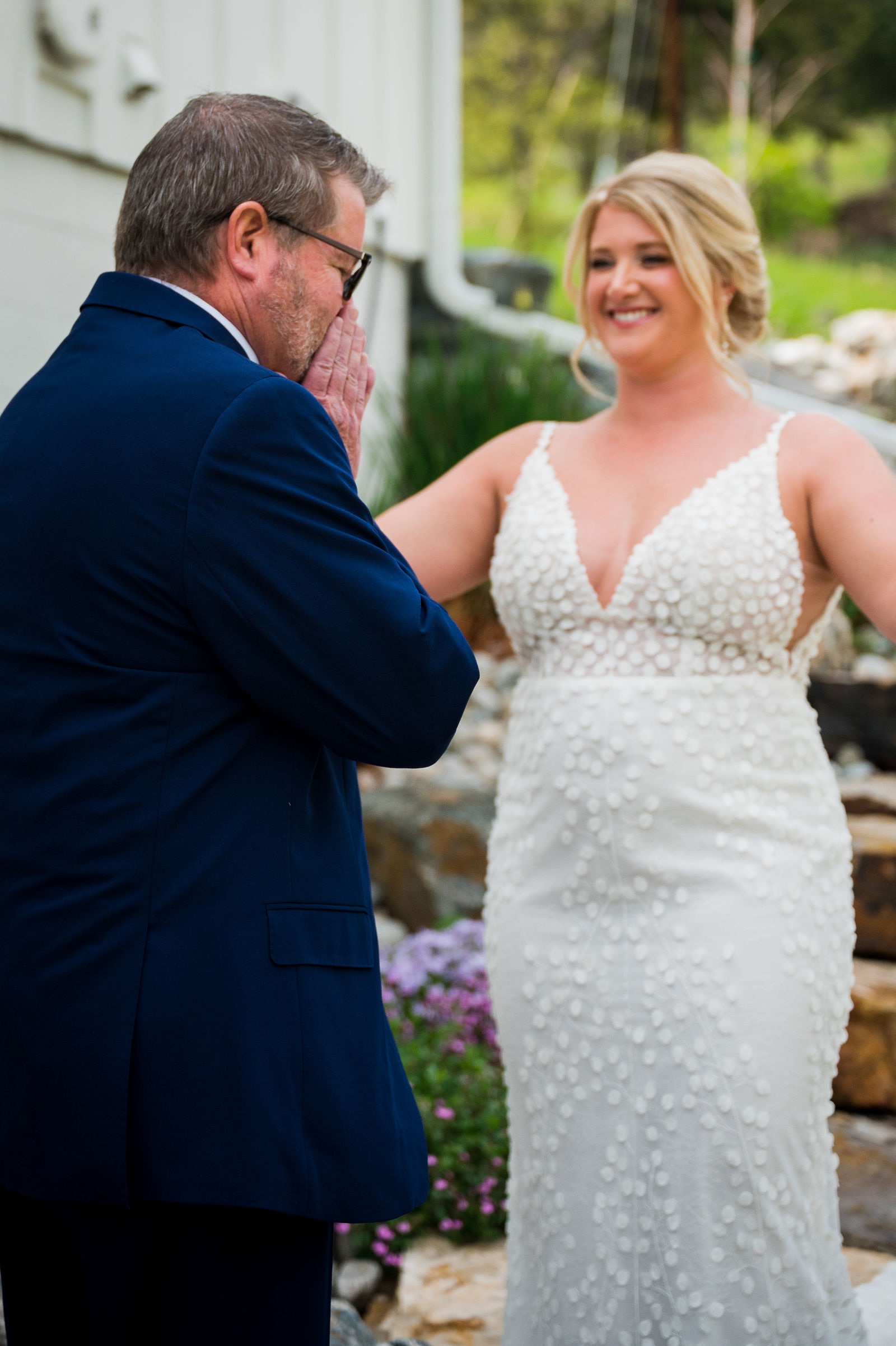 Father of the bride turning around for his first look with his daughter