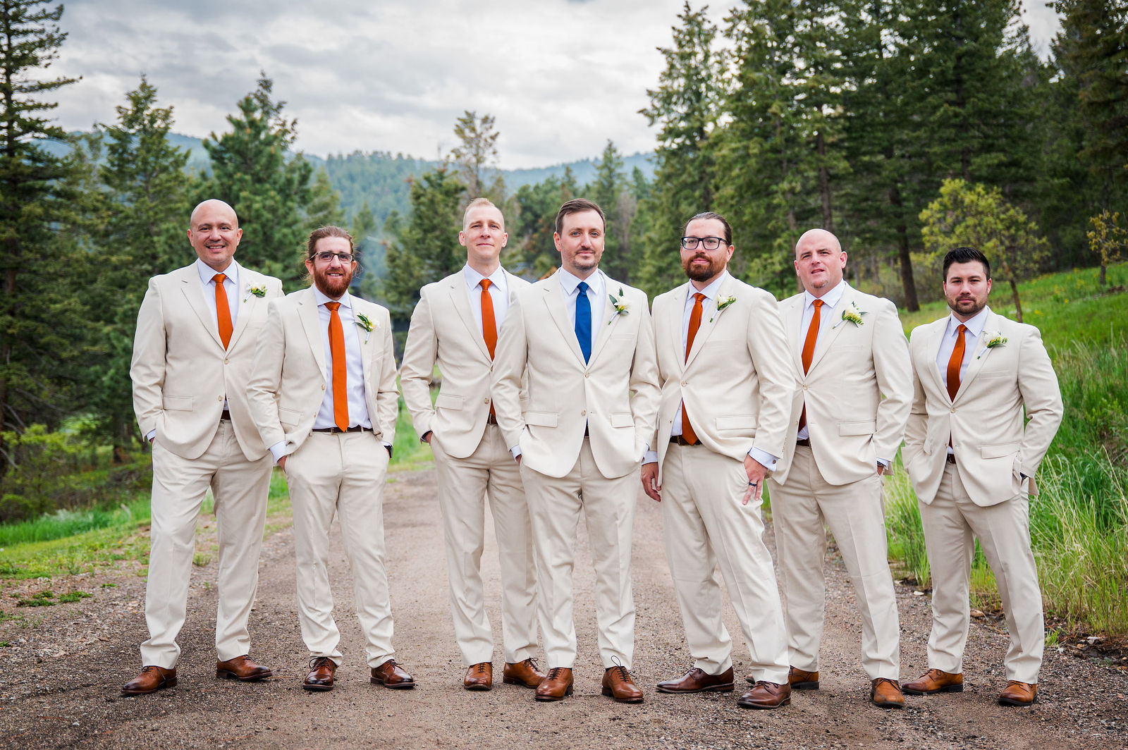 Groomsmen in cream suits at The Woodlands wedding venue in Morrison Colorado