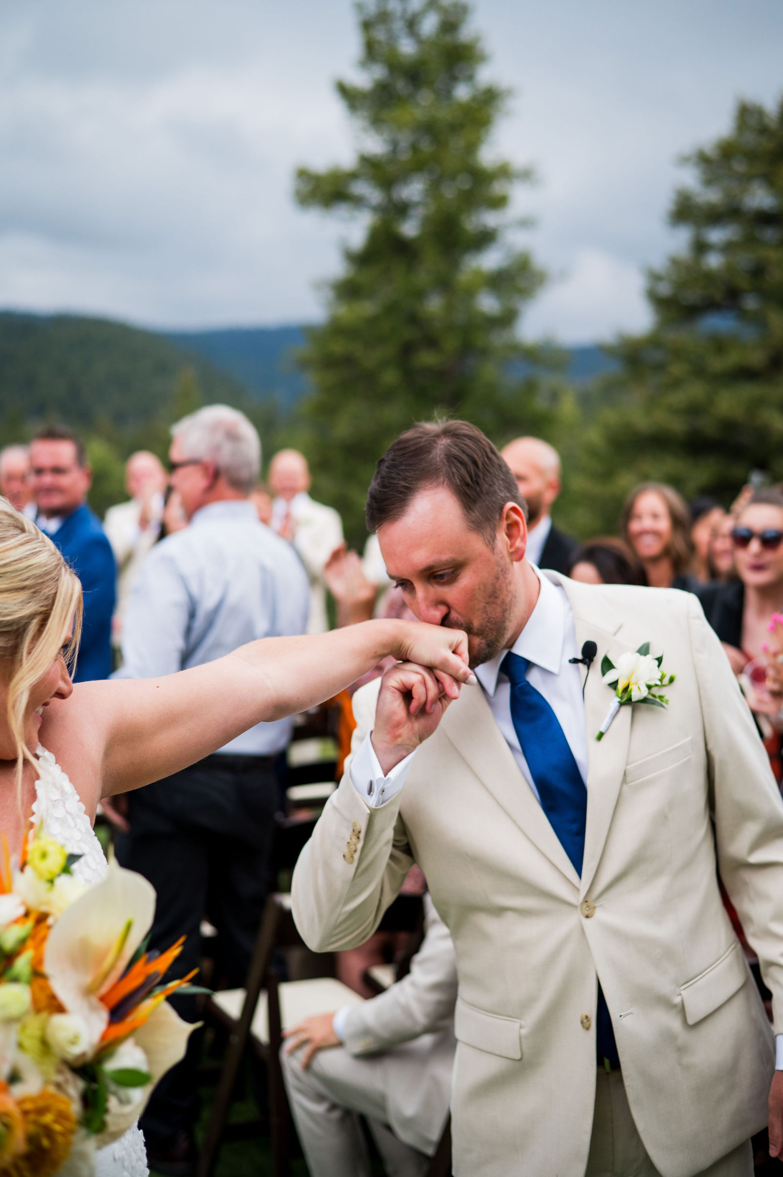 Wedding guest wiping away tears during a Morrison Colorado ceremony