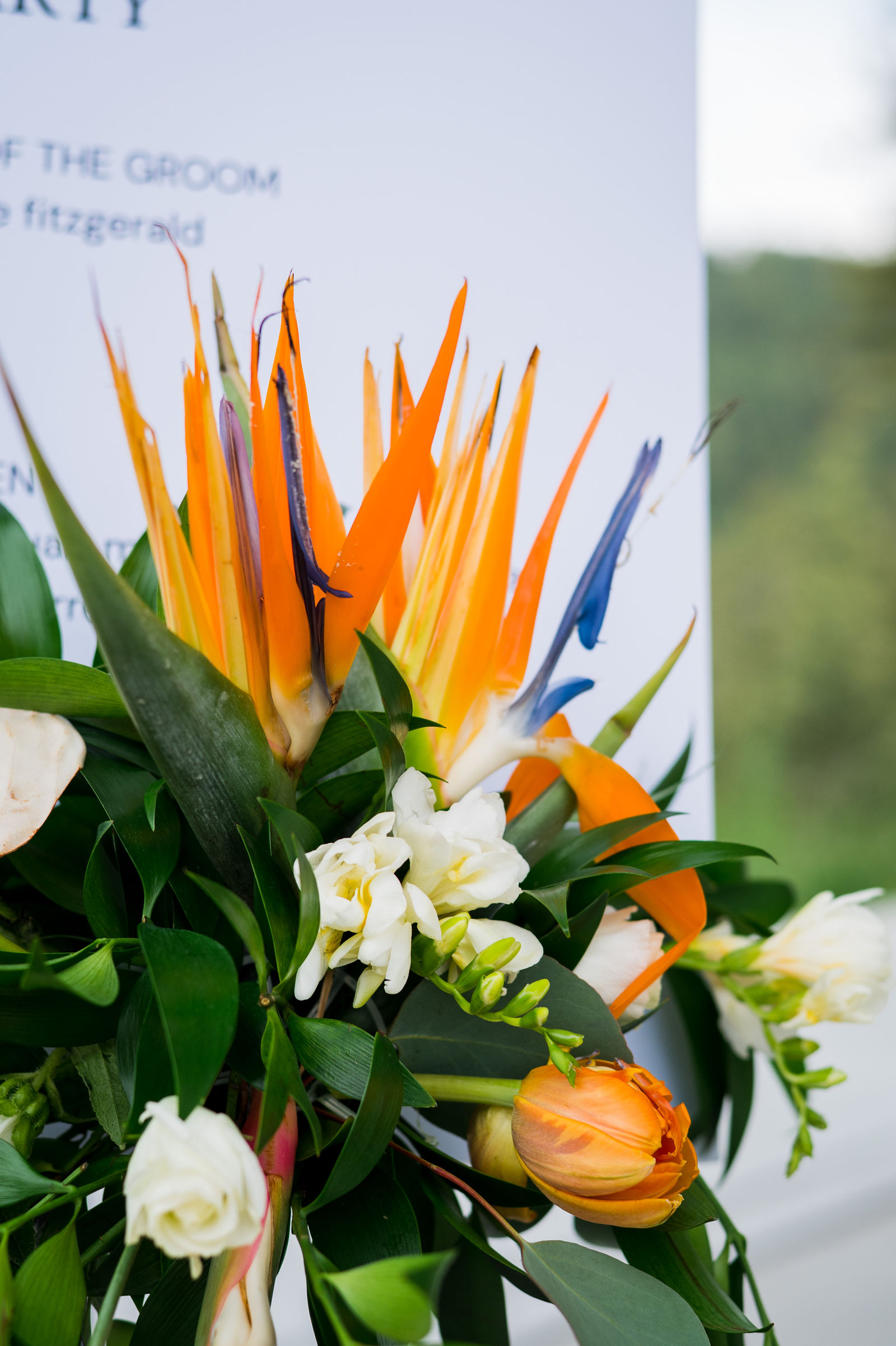 Wedding welcome sign with a Bird of Paradise arrangement at The Woodlands