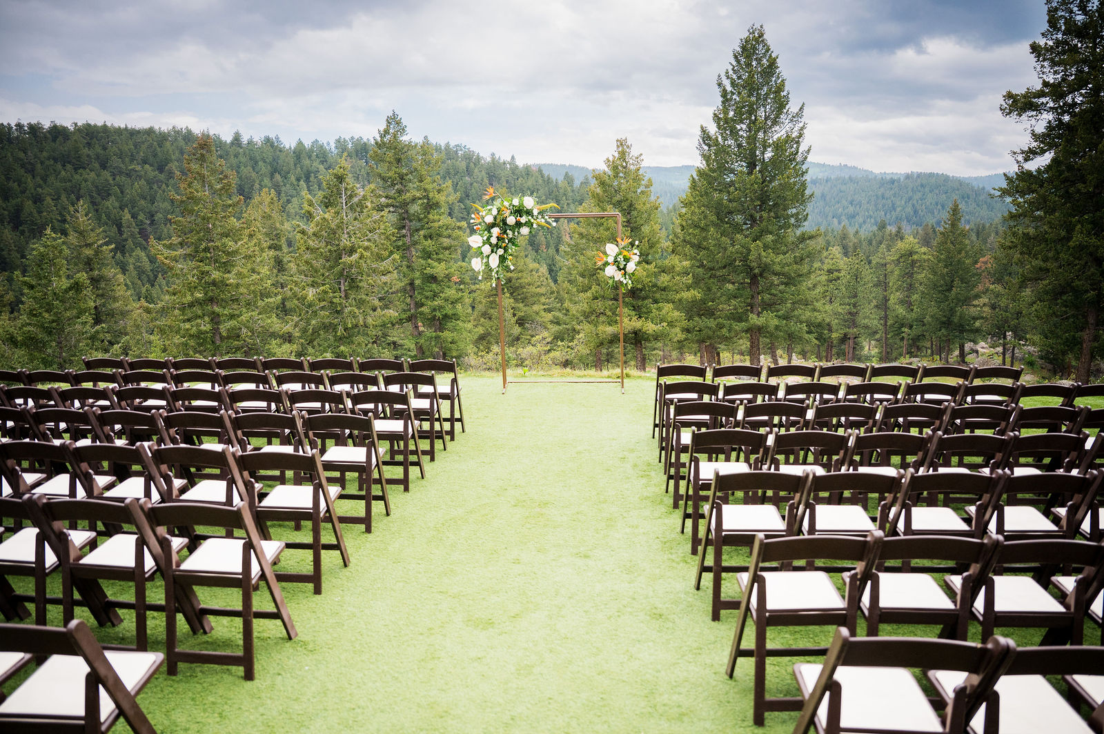 Ceremony chairs facing the mountains at The Woodlands in Morrison Colorado