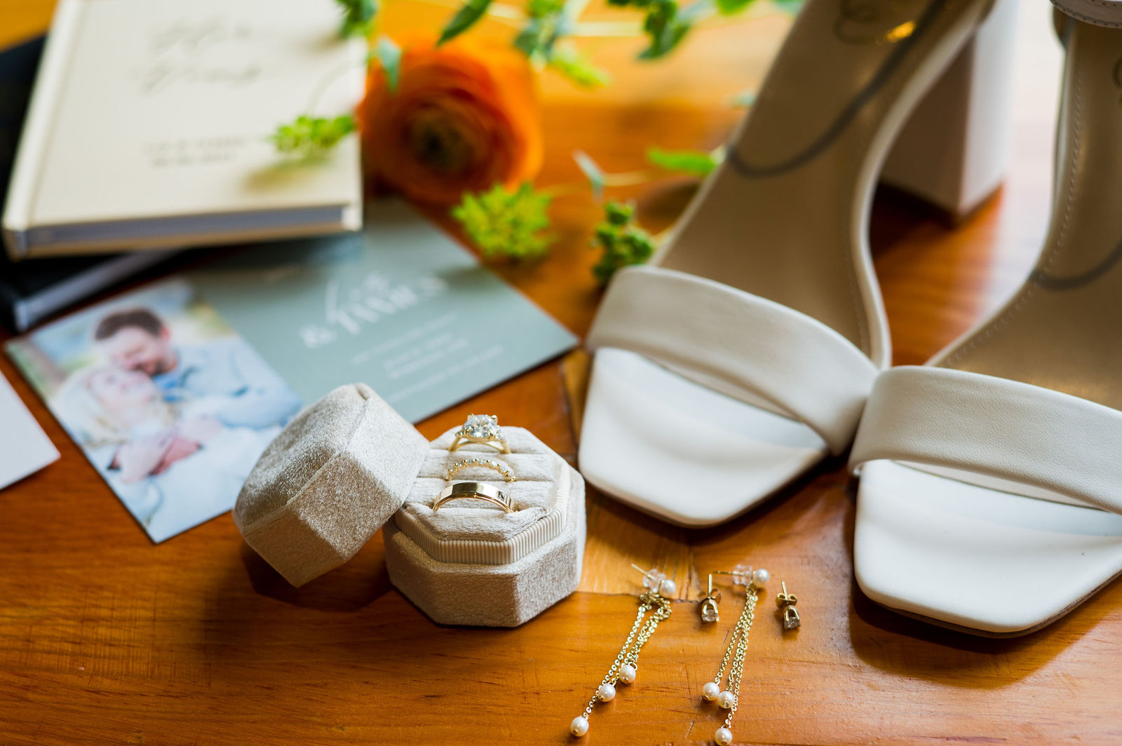 Wedding day flat lay with invitations, rings and shoes in Colorado