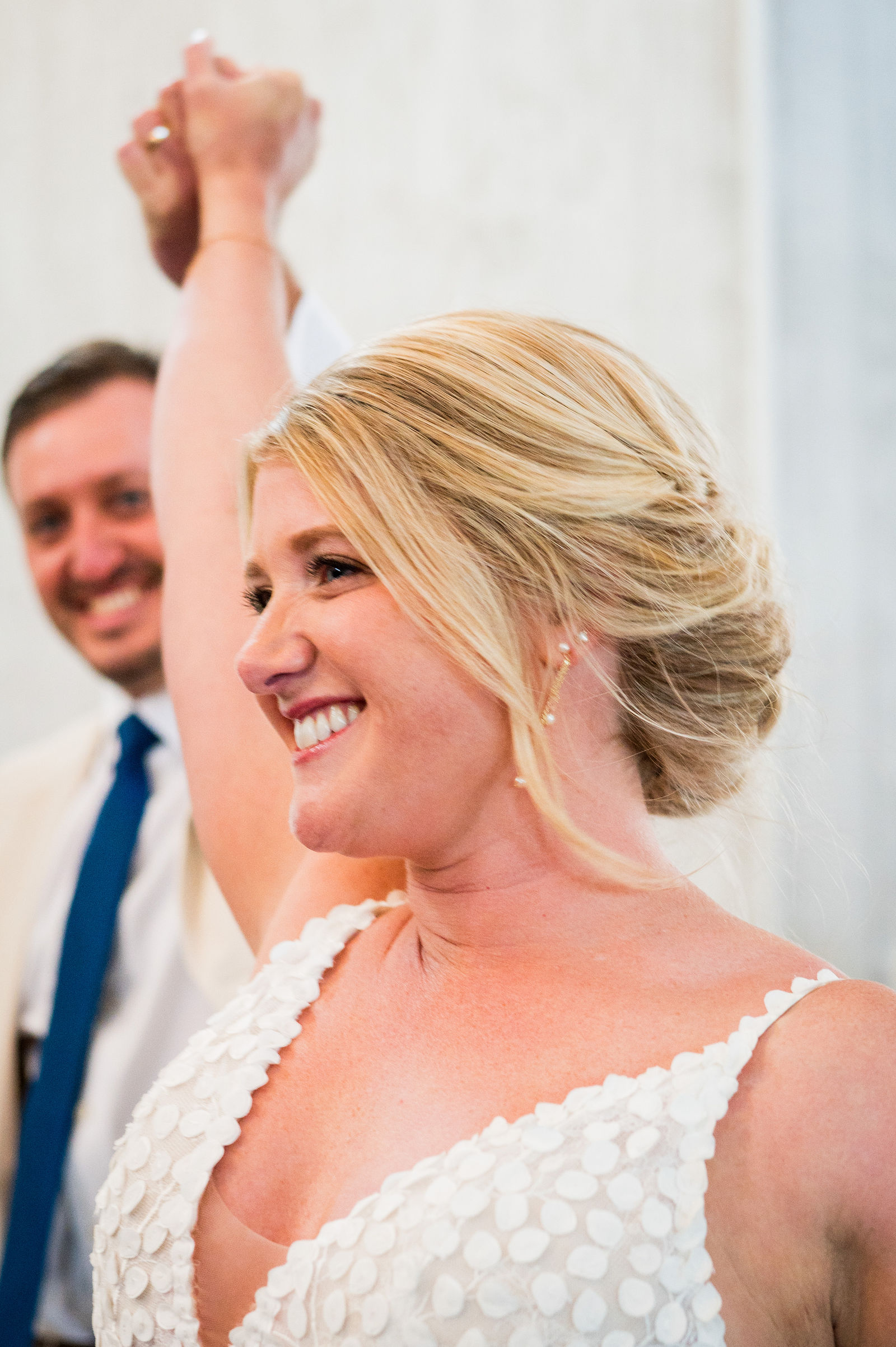 Bride laughing during her grand entrance at The Woodlands in Morrison Colorado