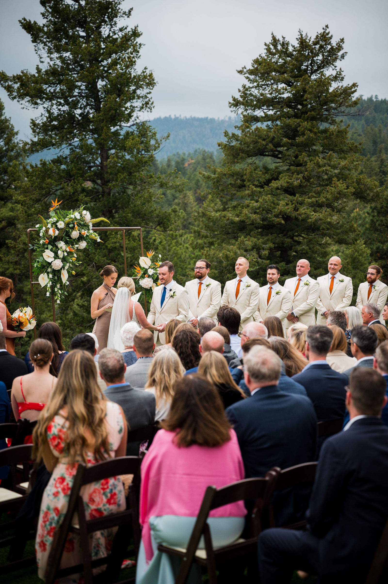 Wide view of an outdoor wedding ceremony at The Woodlands in Colorado