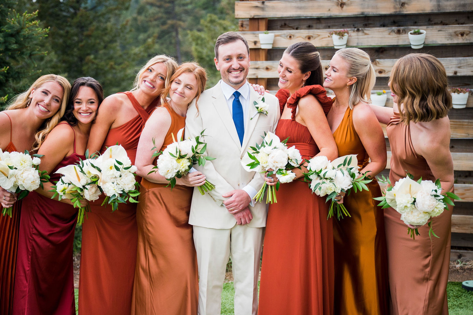 Wedding party laughing together at The Woodlands in Colorado