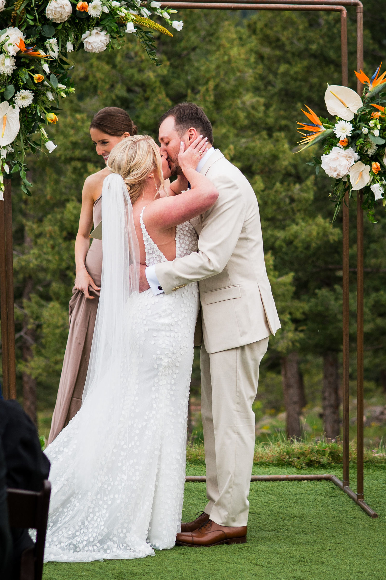 First kiss as a married couple at The Woodlands in Morrison Colorado