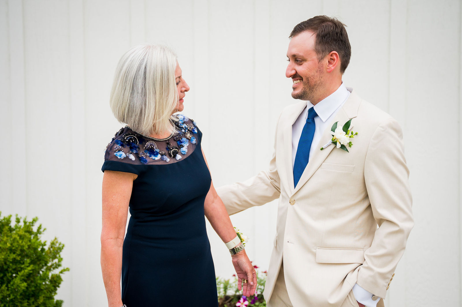 Groom’s first look with his mother at The Woodlands wedding venue
