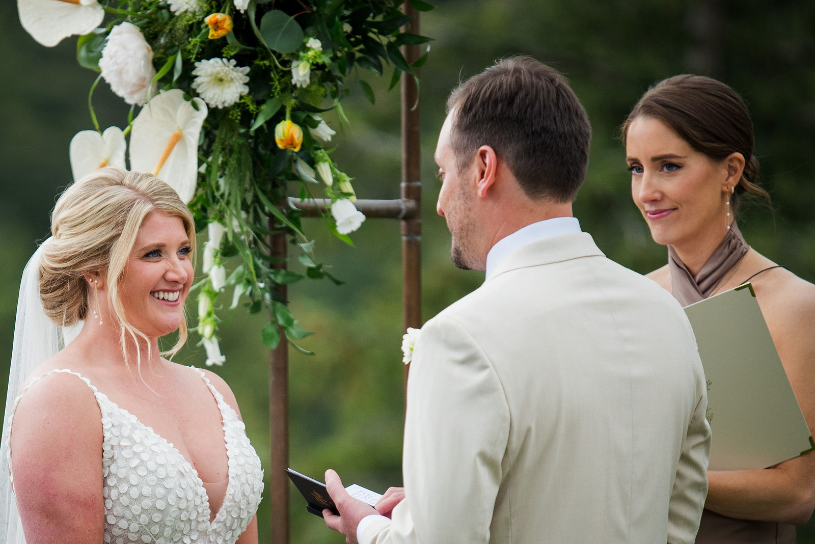 Bride reading her vows at an outdoor ceremony in Morrison Colorado