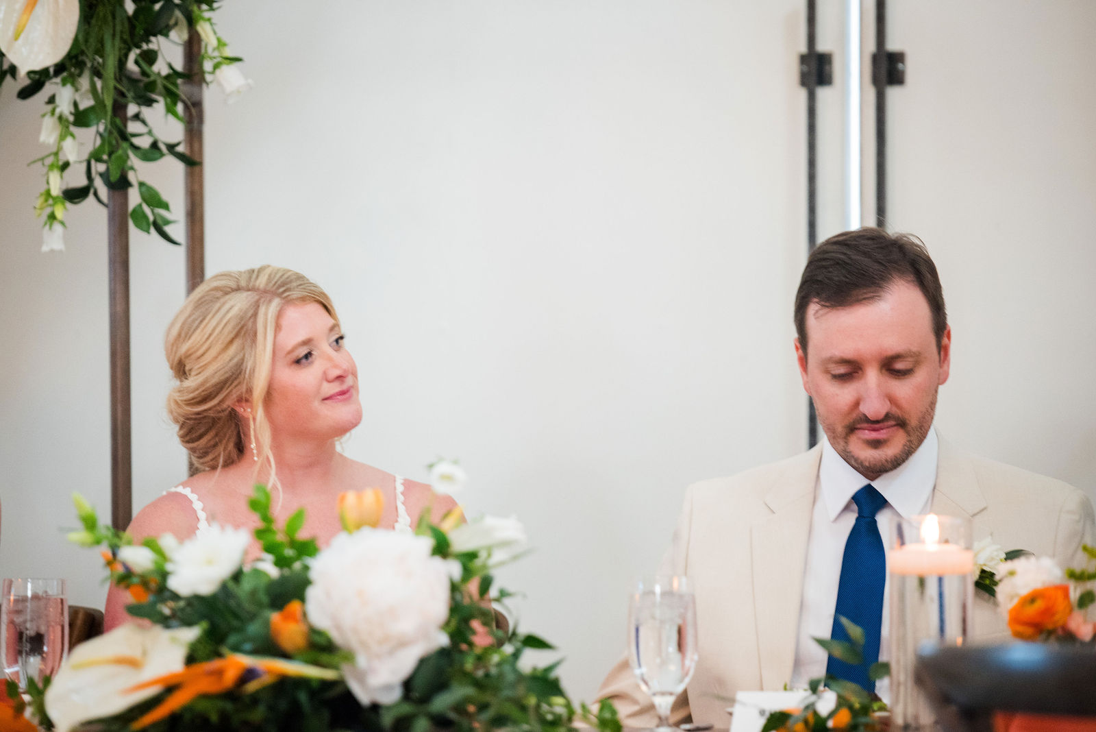 Bride and groom listening to toasts at The Woodlands wedding venue