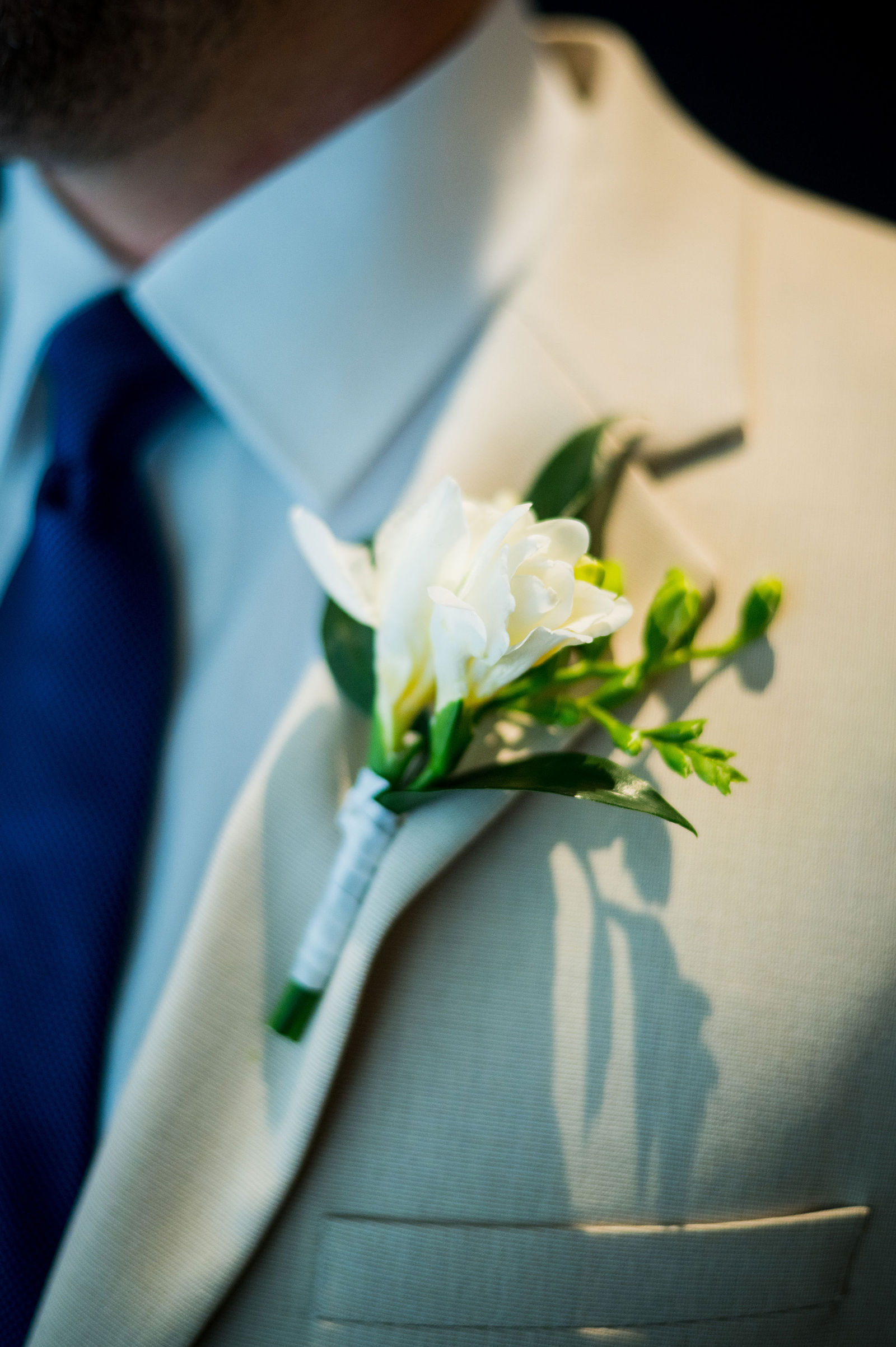 Bird of Paradise boutonniere on a cream suit at a Morrison Colorado wedding