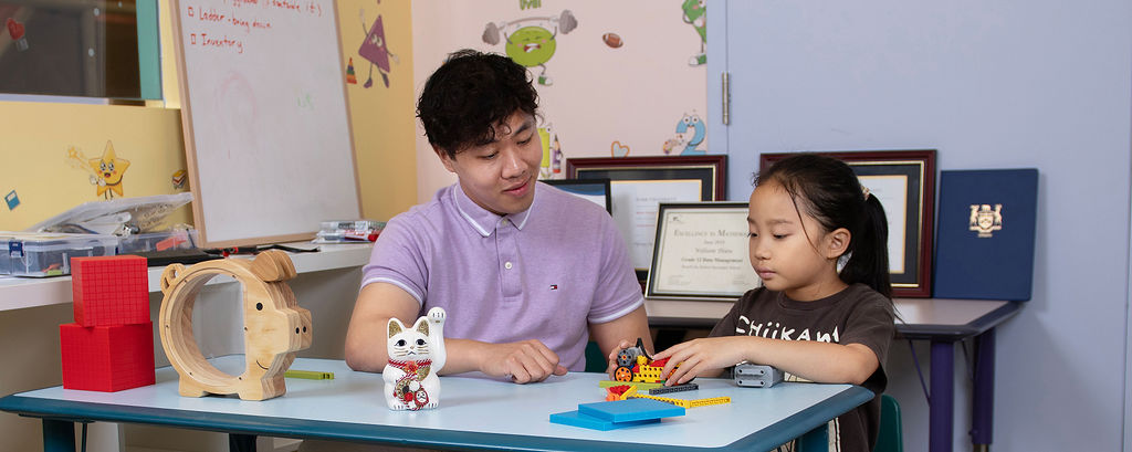William working through a problem with a student at InnEd Academy