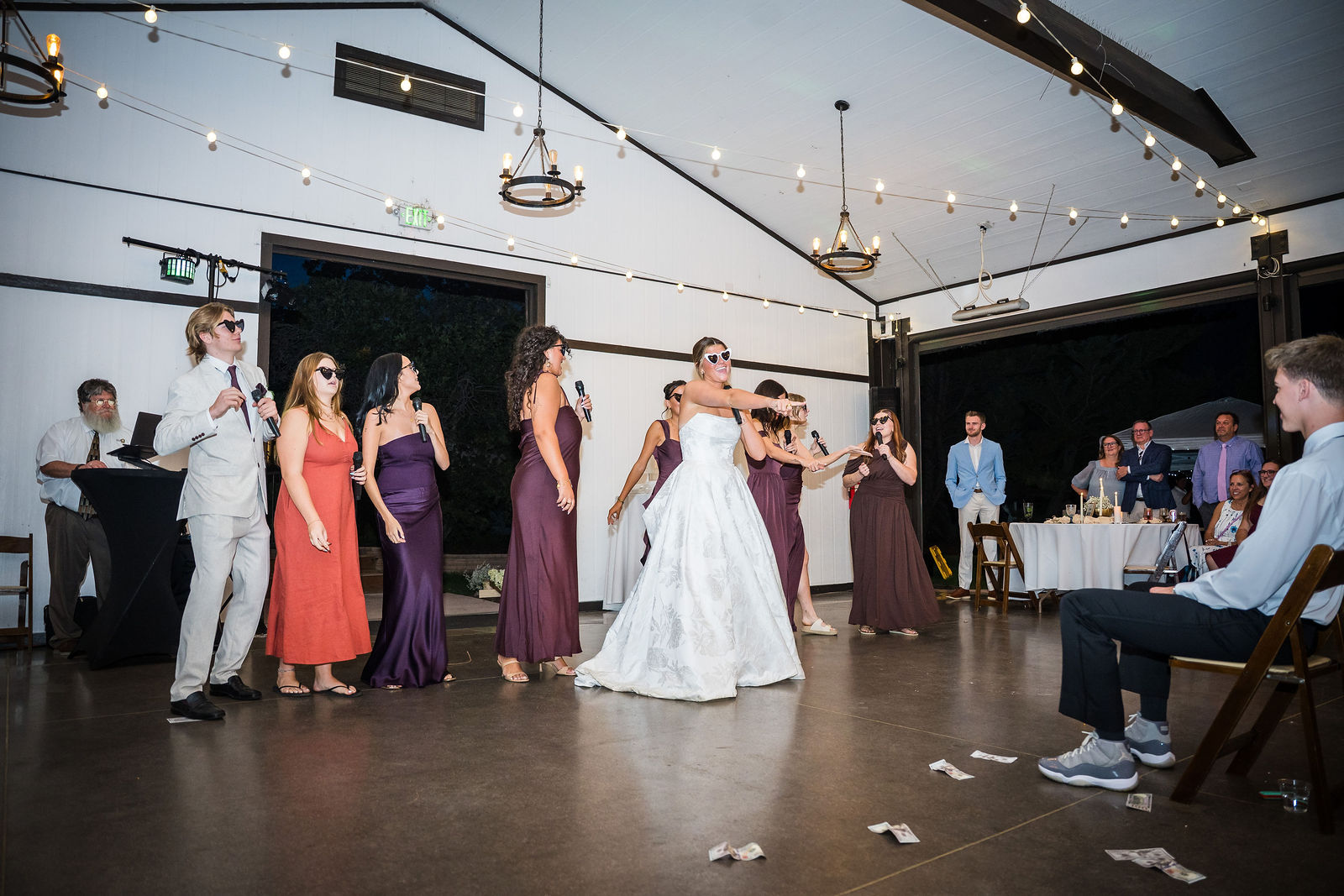 Bride and friends performing a choreographed dance at the reception