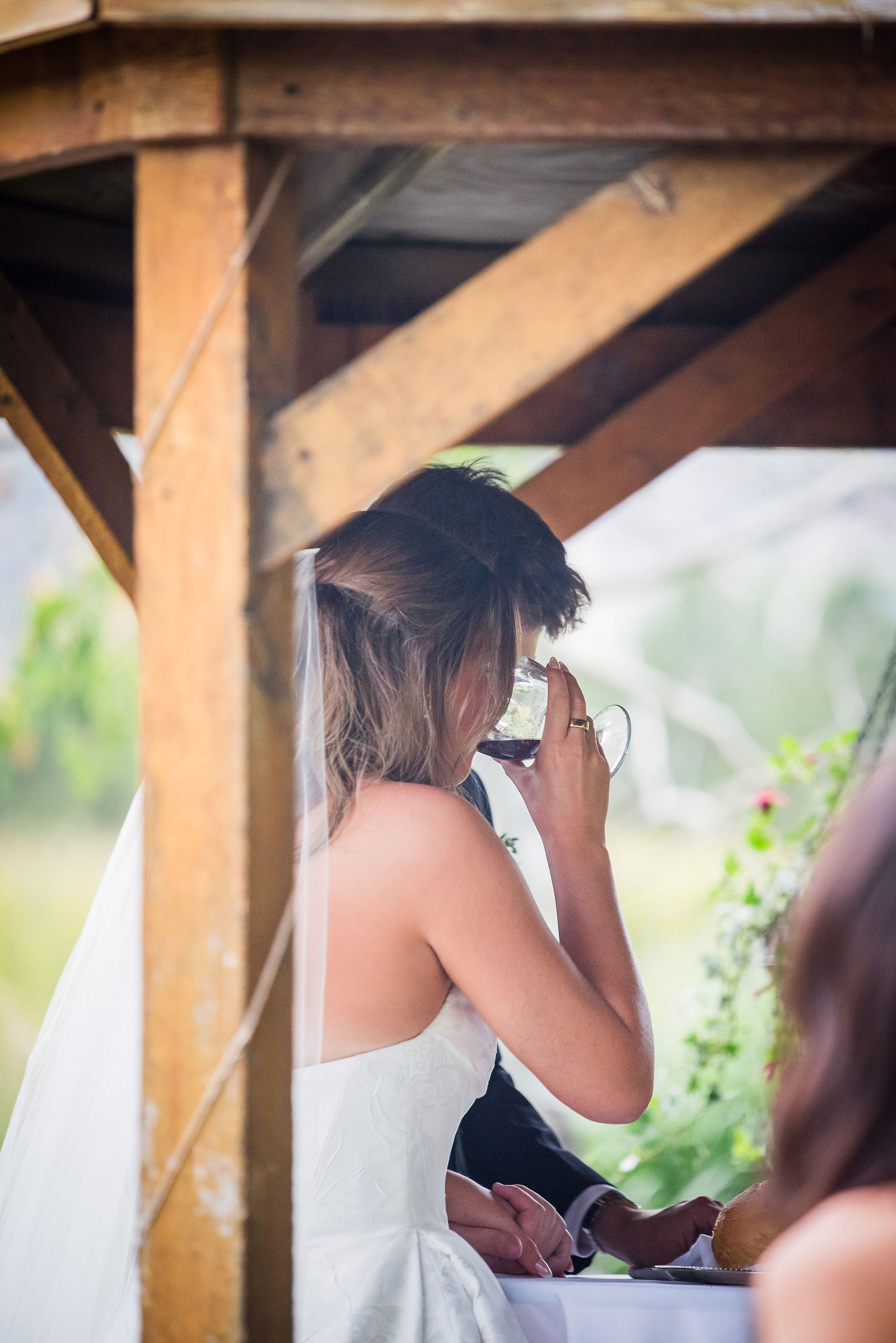 Bride wiping away tears during her ceremony