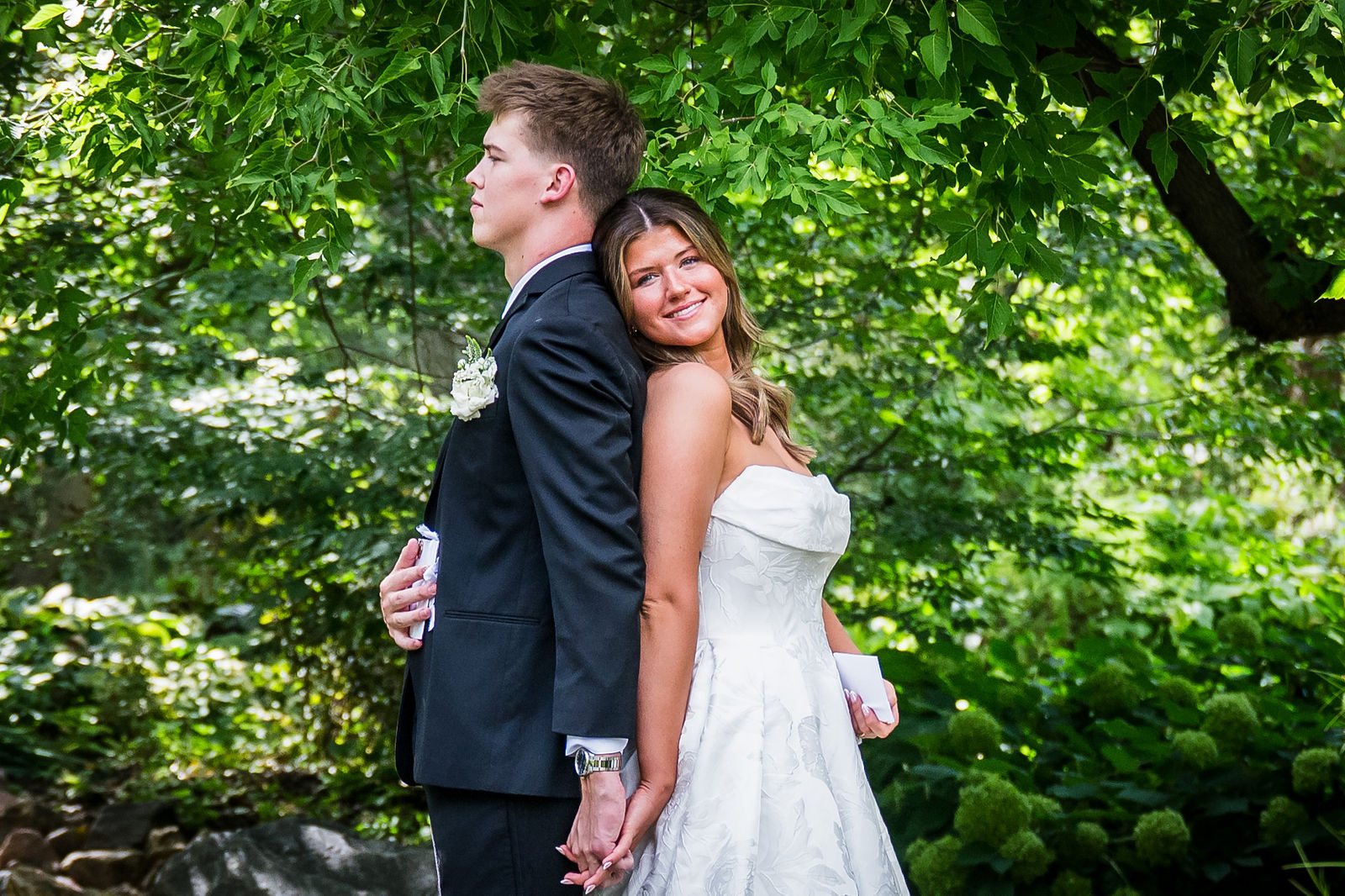 Bride resting her head on her groom’s shoulder