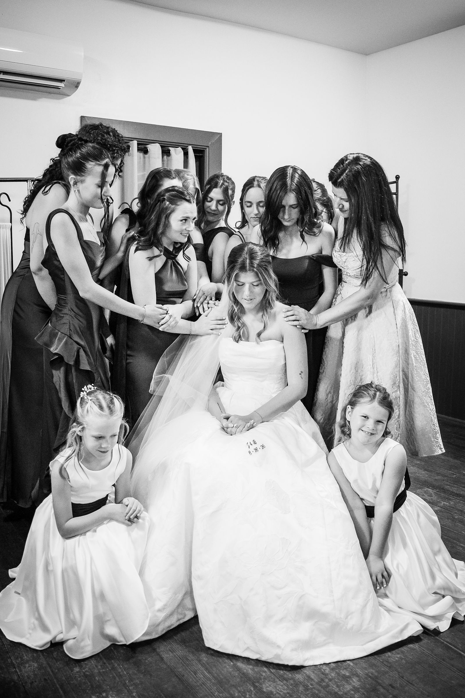 Bride with the flower girls before the ceremony