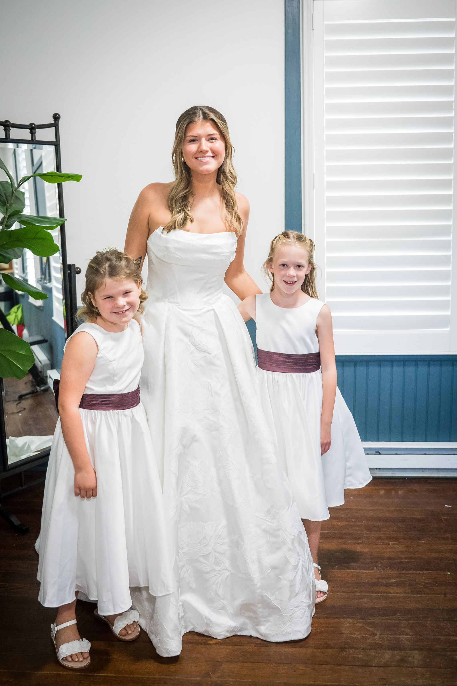 Bride with her flower girls before the ceremony