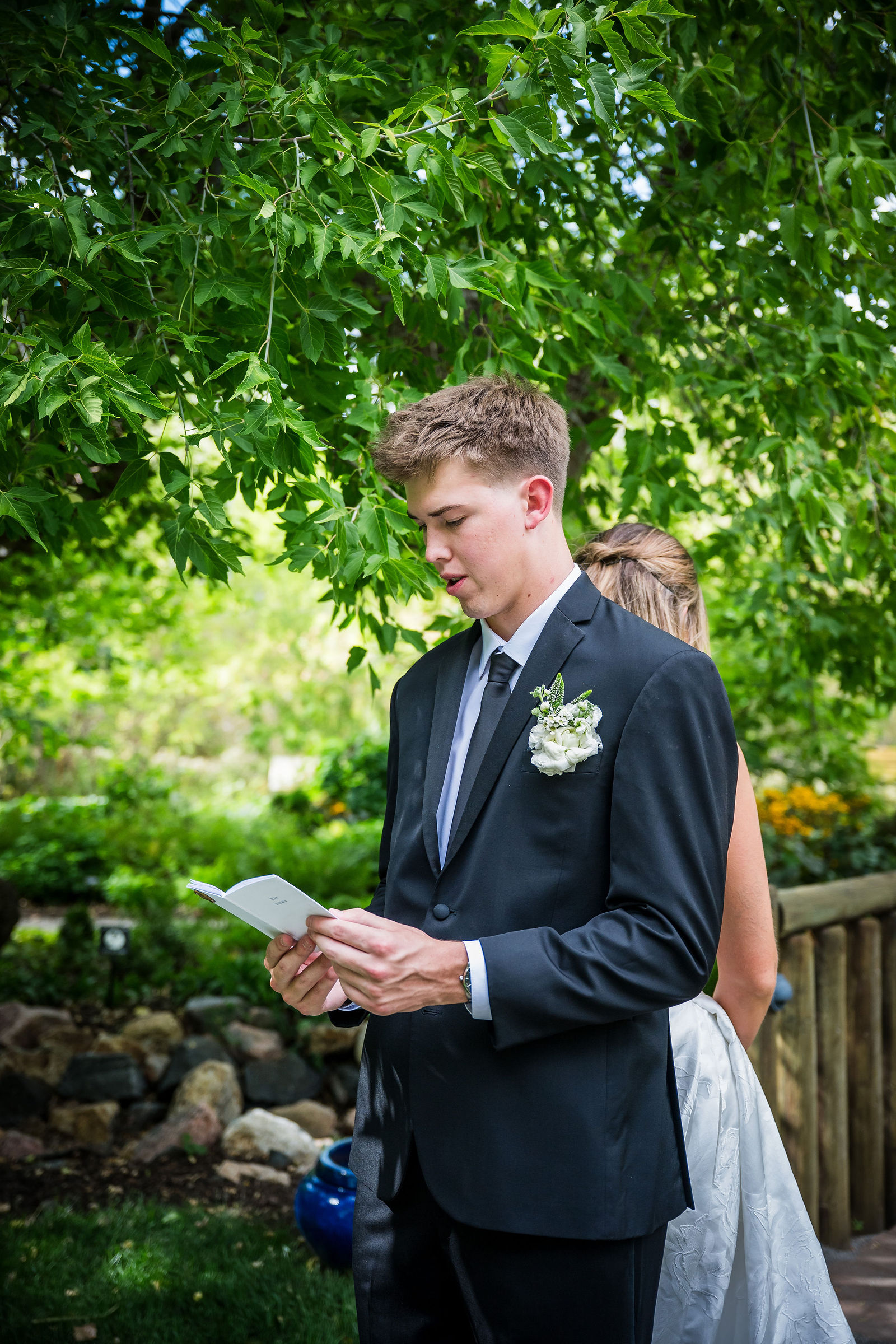 Groom reading his private vows aloud