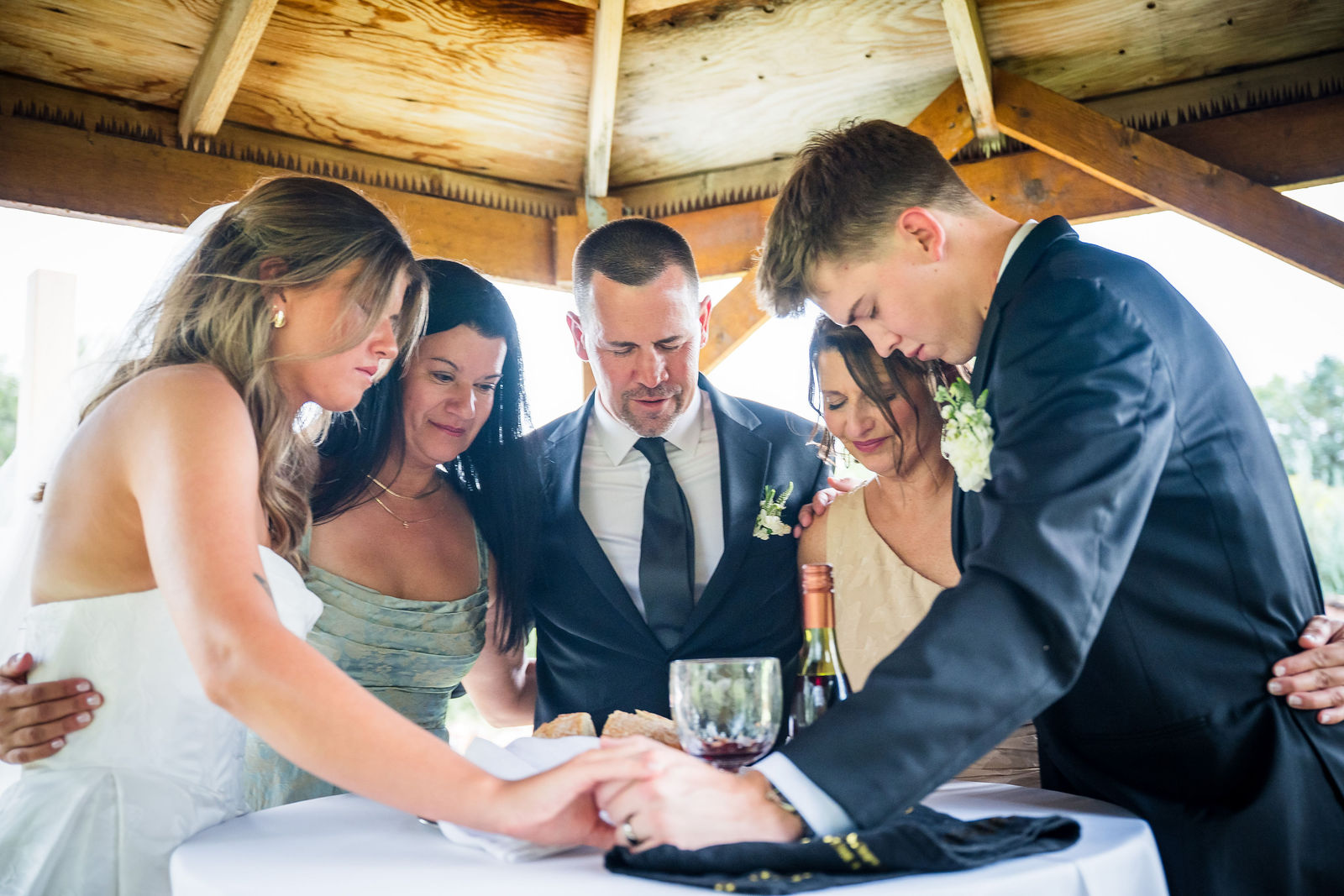 Bride and groom taking communion together at their wedding