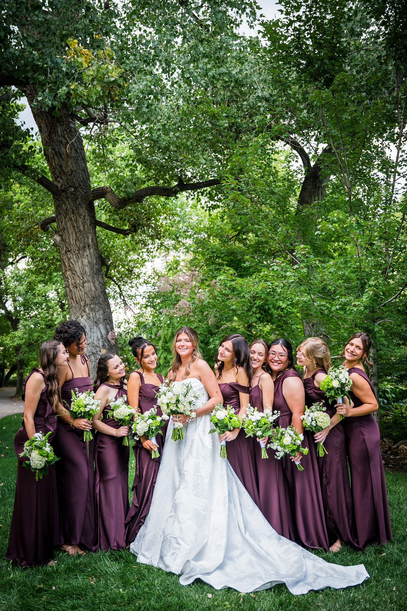 Bride laughing with her bridesmaids