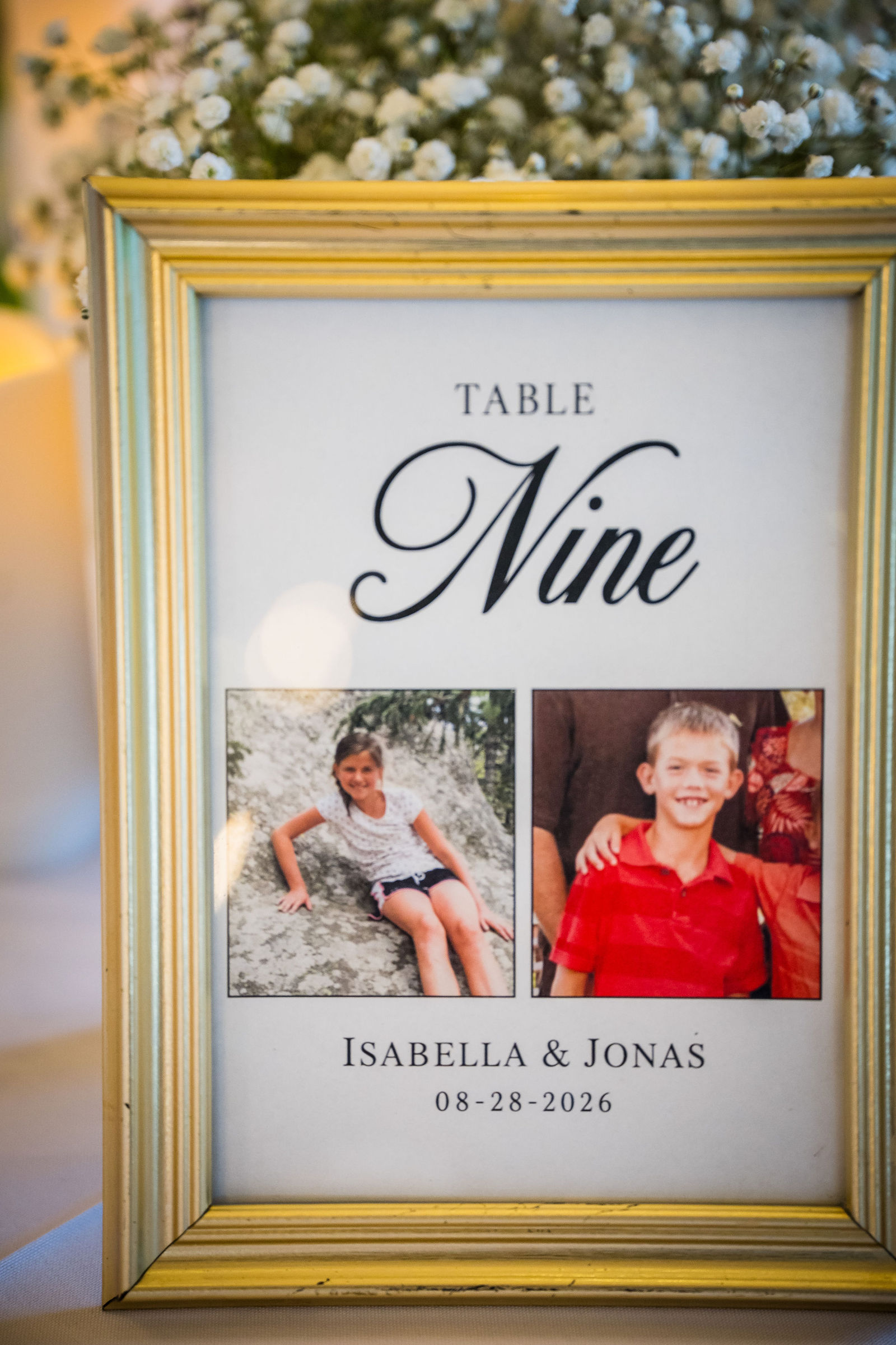 Table number made from childhood photos of the couple