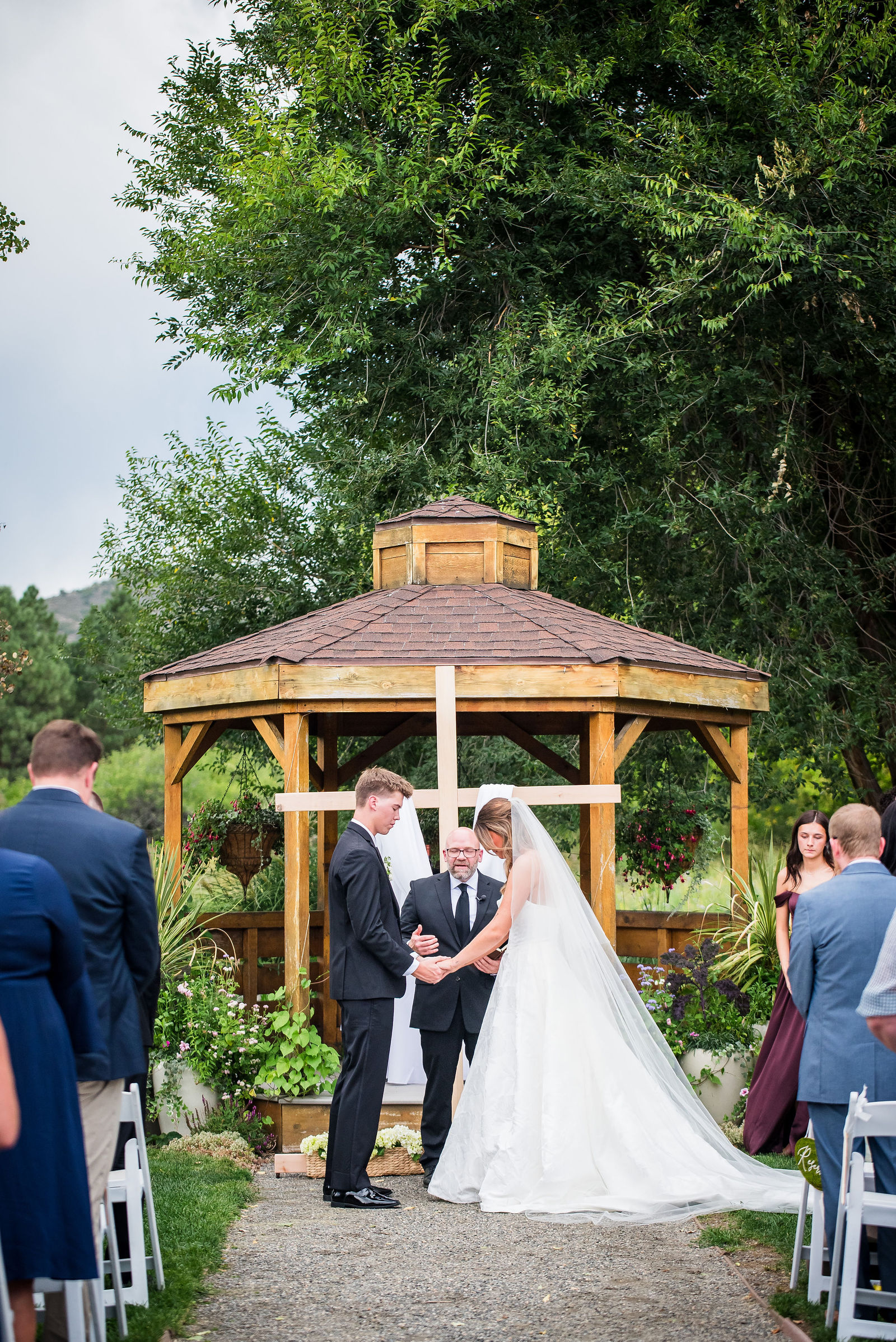 Wedding party standing at the gazebo during a Colorado ceremony