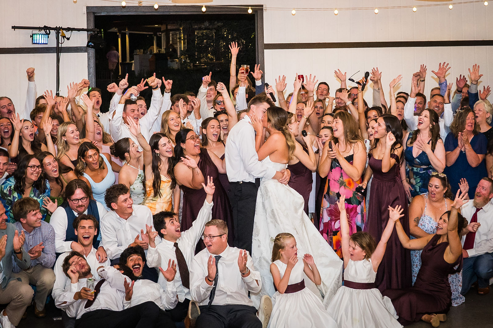 Packed dance floor at a Colorado barn wedding reception
